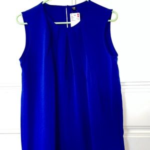 Uniqlo blue top. Polyester. Never worn. Size large